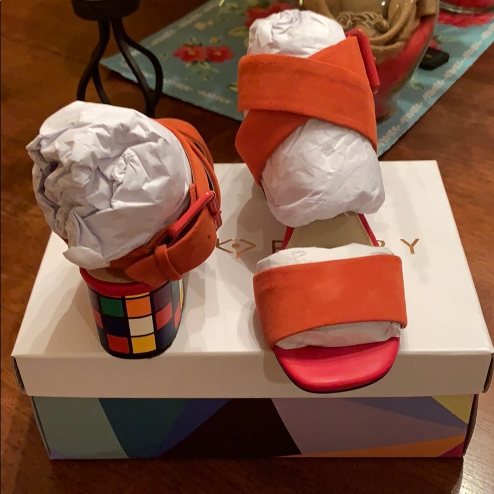 Orange sandals with puzzle heel